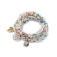 Lovra bracelet coiled to show leaf pendant and bead pattern from above