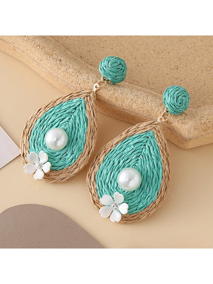 Detailed shot of Earedge earrings highlighting smooth teardrop design