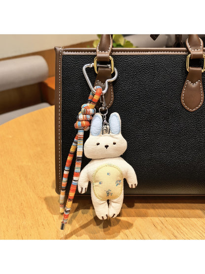 Close-up of Keypus kitty charm showing detailed facial features and soft colors