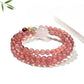Close-up of Lovra pink crystal bead bracelet showing detailed bead texture and gold spacers