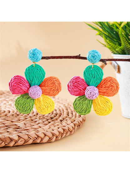 Model wearing earedge cute flower shaped knitted earrings with short hair