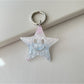 Star pendant keychain shown with a close-up of the keyring attachment