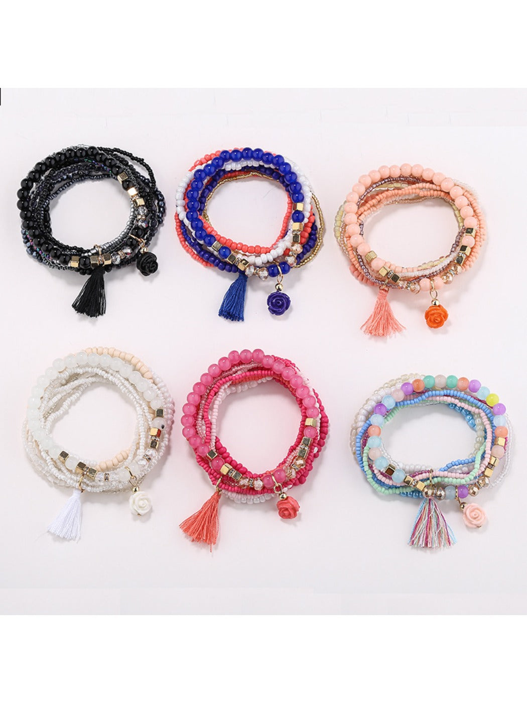 Lovra flower shaped pendant on a pink beaded bracelet displayed on a white background