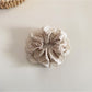 Beau Polka Dot Lace Scrunchie worn on a wrist, styled as an accessory