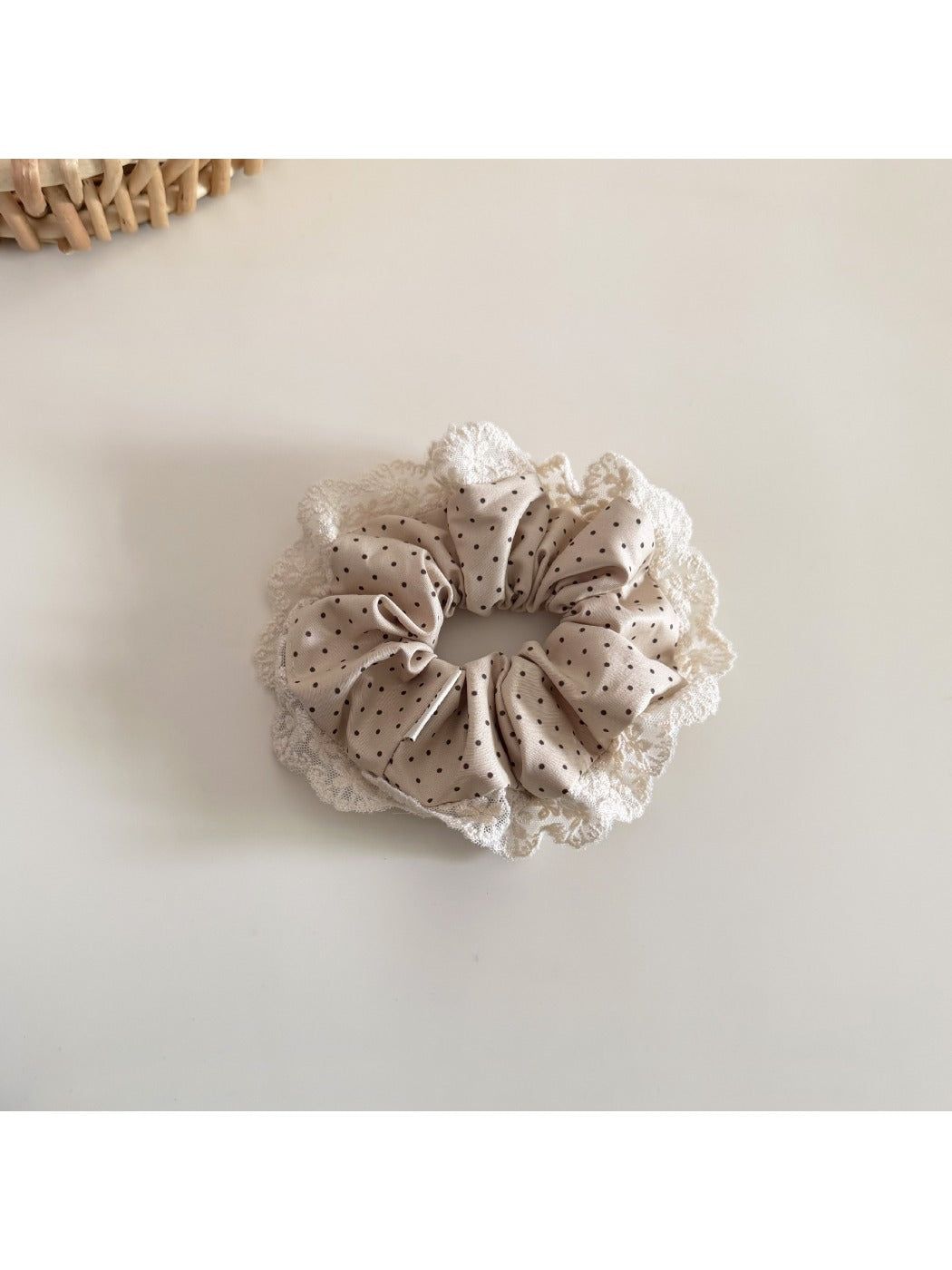 Beau Polka Dot Lace Scrunchie worn on a wrist, styled as an accessory
