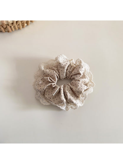 Beau Polka Dot Lace Scrunchie worn on a wrist, styled as an accessory