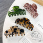Beau double row crescent shaped claw clip in glossy tortoiseshell finish