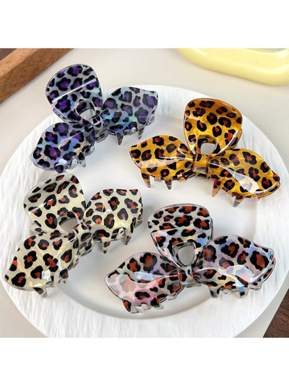 Close-up of Beau leopard print bow claw clip showing textured pattern