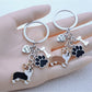 Puppy-shaped keychain with detailed facial features and a metal keyring