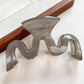 Beau wave-shaped hair claw clip in matte black with soft shadows