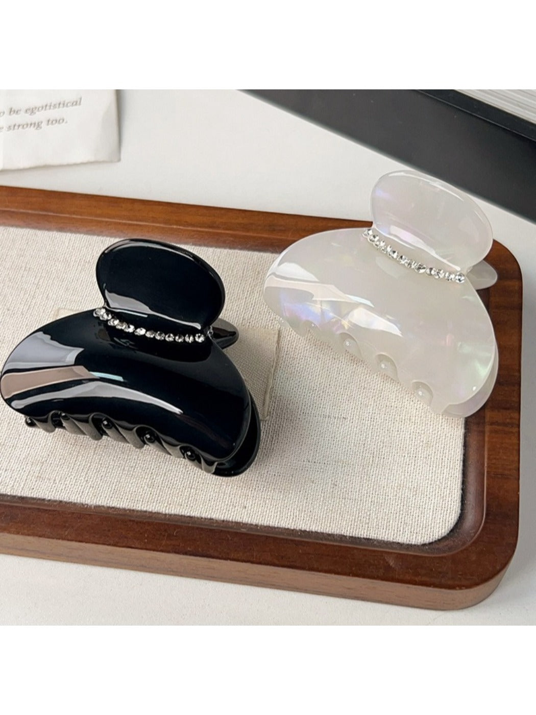 Beau hair claw clip in matte black, top view highlighting smooth finish