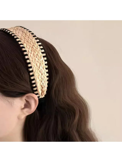 Close-up of the textured fabric and stitching details of the bohemian wide headband