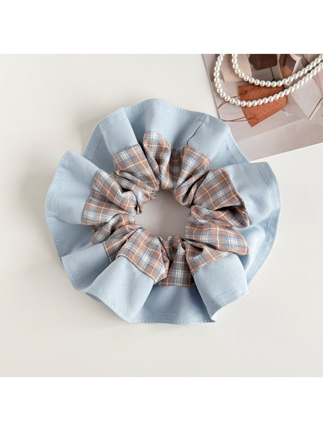 Side view of Gifty color block plaid scrunchie highlighting fabric folds