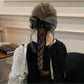Gifty scrunchie styled on a wrist as a fashionable accessory