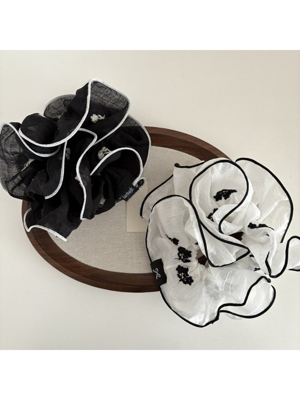 Beautiful scrunchie displayed on a white background showing fabric texture
