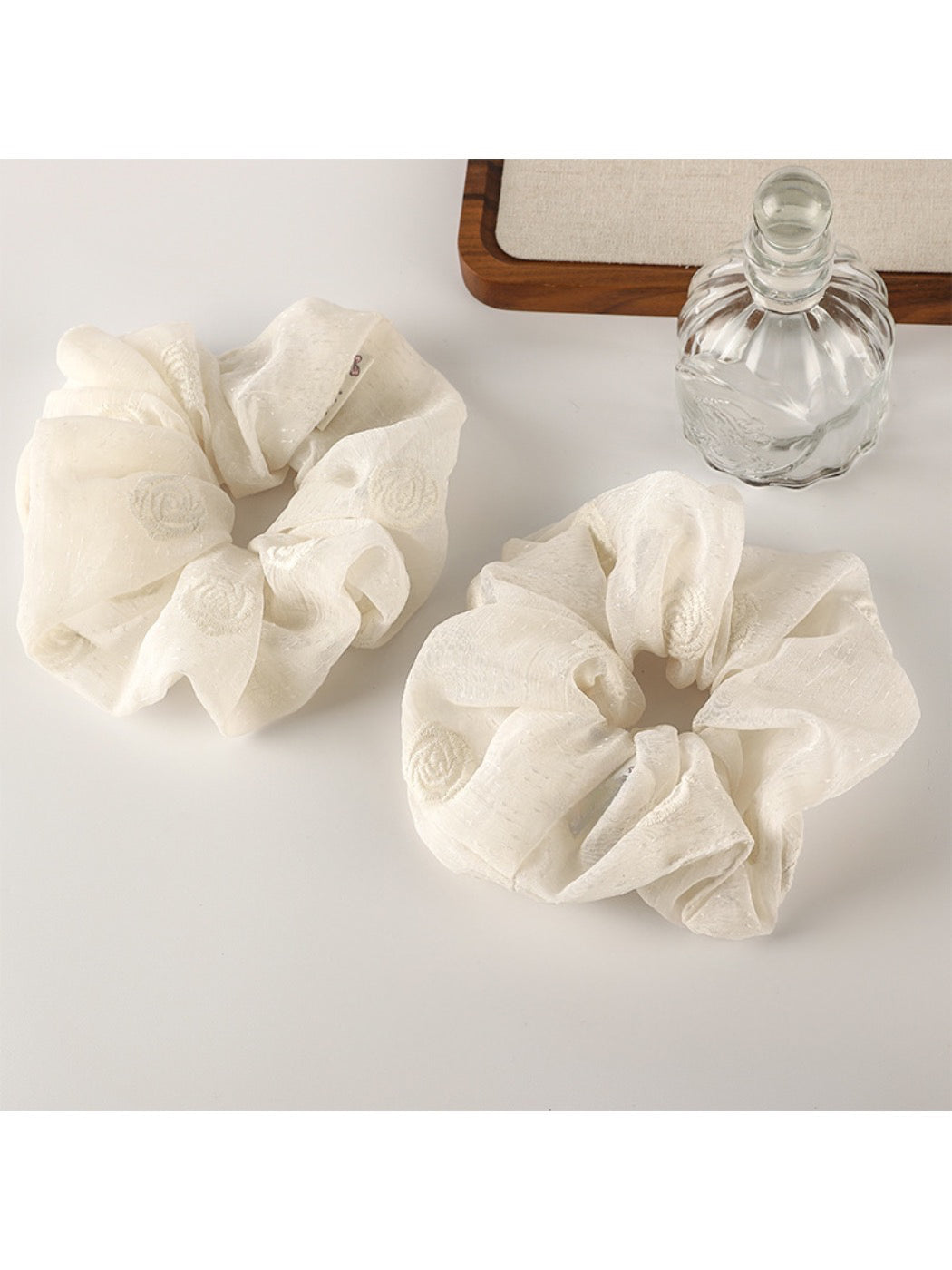 Close-up of Gifty timeless versatile fashion scrunchie in soft beige fabric