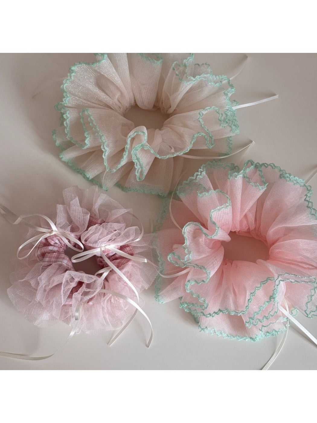Side view of Gifty Ribbon Knot Tulle Scrunchie showing delicate tulle fabric and ribbon knot