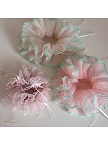 Side view of Gifty Ribbon Knot Tulle Scrunchie showing delicate tulle fabric and ribbon knot