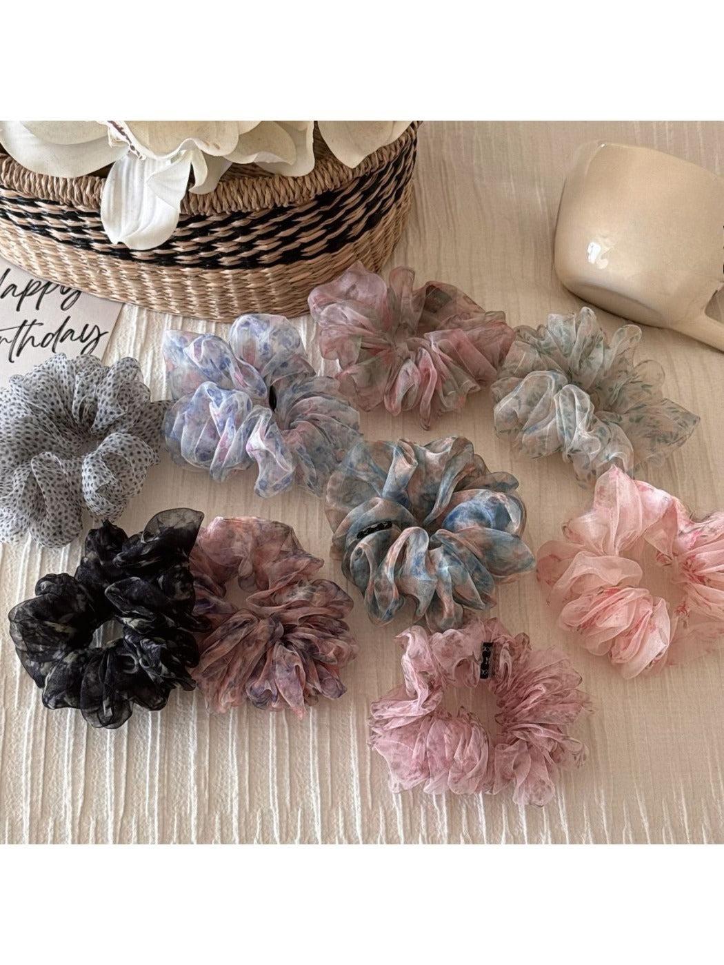 Colorful ditsy floral scrunchie on a white background