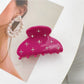 Beau chic crescent hair claw clip styled in a low bun hairstyle