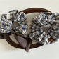 Gifty vintage plaid bow scrunchie styled in a ponytail on a model