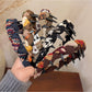 Gifty knitted fabric wrapped headband displayed on a white background
