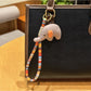 Elephant charm keychain with a shiny silver finish and smooth texture