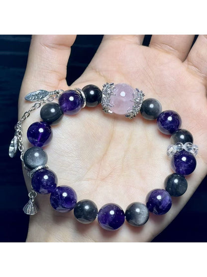 Close-up of Lovra stylish purple crystal beads and silver detailing on bracelet
