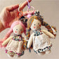 Side view of Keypus cartoon doll keychain showing detailed hair and outfit design