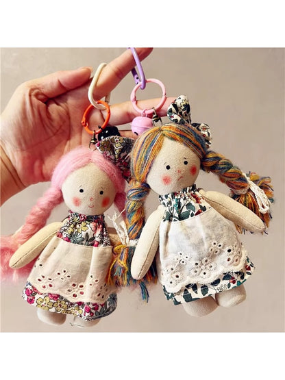 Side view of Keypus cartoon doll keychain showing detailed hair and outfit design