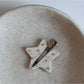 Beau printed triangle star hair clip shown from above emphasizing star pattern and shape