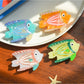 Close-up of Beau tropical fish acetate hair clip showing detailed fish scale pattern