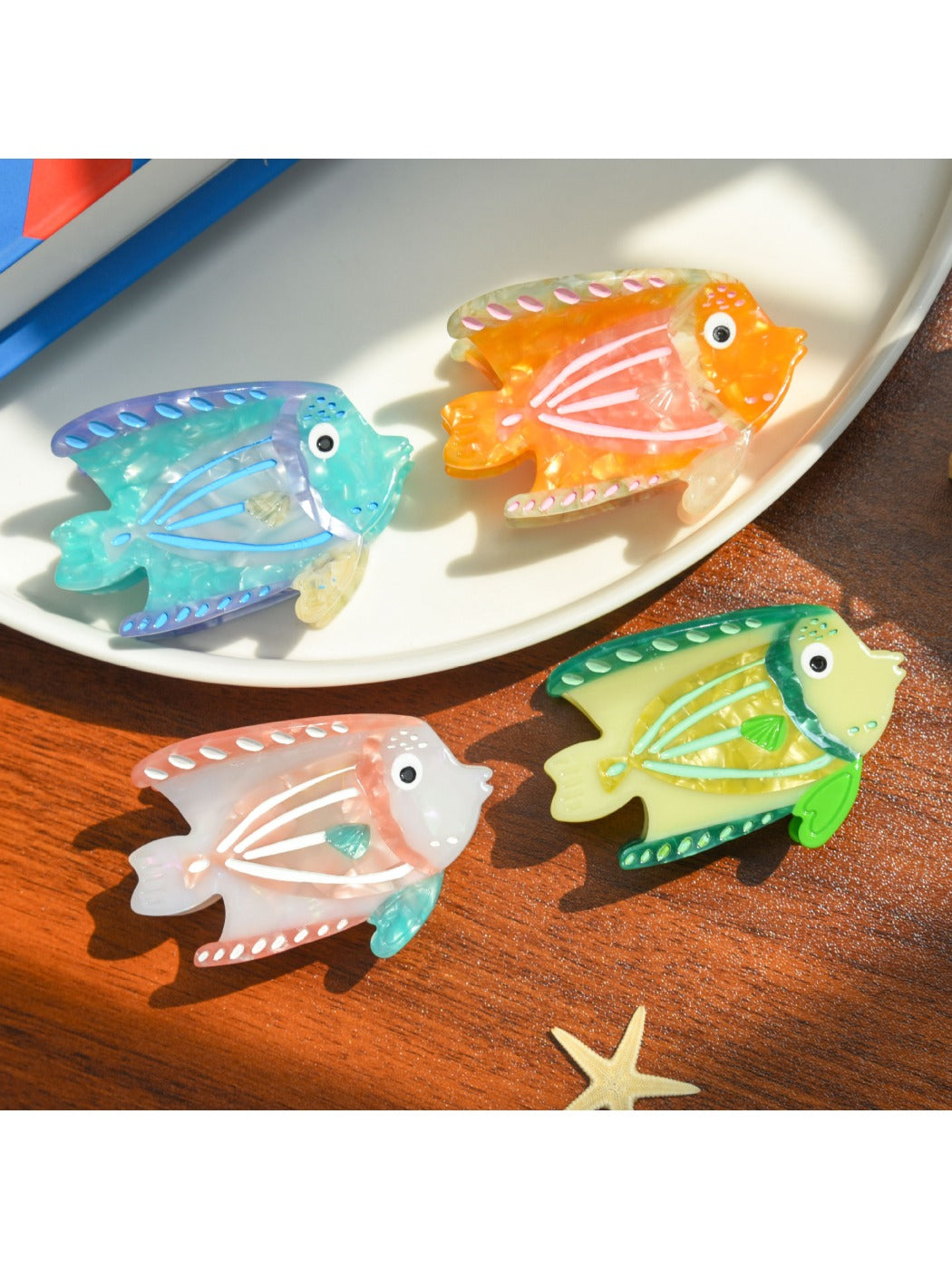 Close-up of Beau tropical fish acetate hair clip showing detailed fish scale pattern