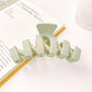 Top view of Beau minimalist wavy hair claw clip in black