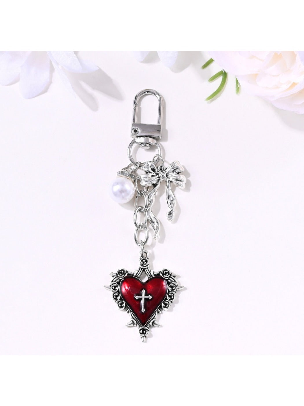 Side view of the alloy heart bow keychain showing thickness and texture