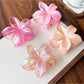 Side view of Beau flower shaped claw clip highlighting clip mechanism