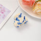 Top view of Beau fresh acetate hair clip showing smooth surface and color variations
