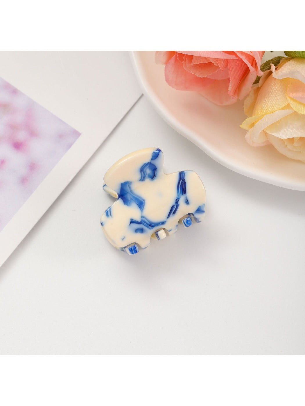 Top view of Beau fresh acetate hair clip showing smooth surface and color variations