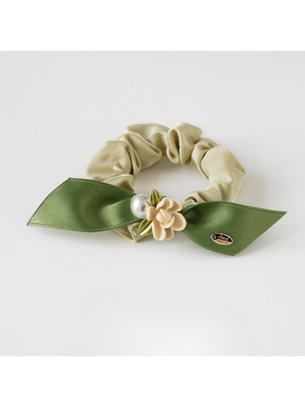 Gifty hair tie styled on a wrist as a bracelet with visible flower details