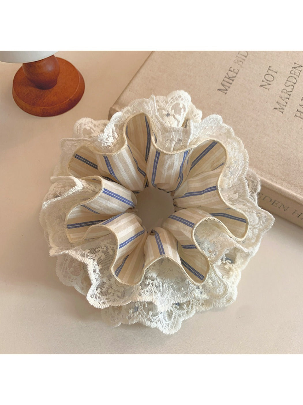 Close-up of striped lace fabric texture on the Gifty scrunchie