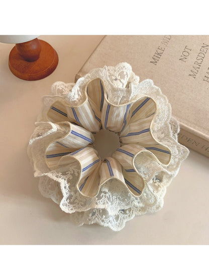 Close-up of striped lace fabric texture on the Gifty scrunchie
