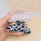 Side view of Beau leopard print claw clip highlighting clip teeth