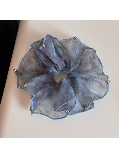 Soft pink tulle scrunchie with glitter, gathered and fluffy