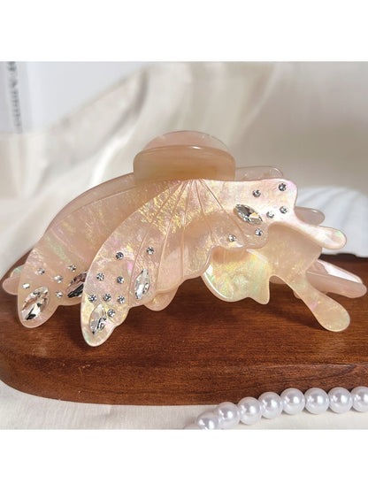 Top view of butterfly hair claw clip showing symmetrical wing design