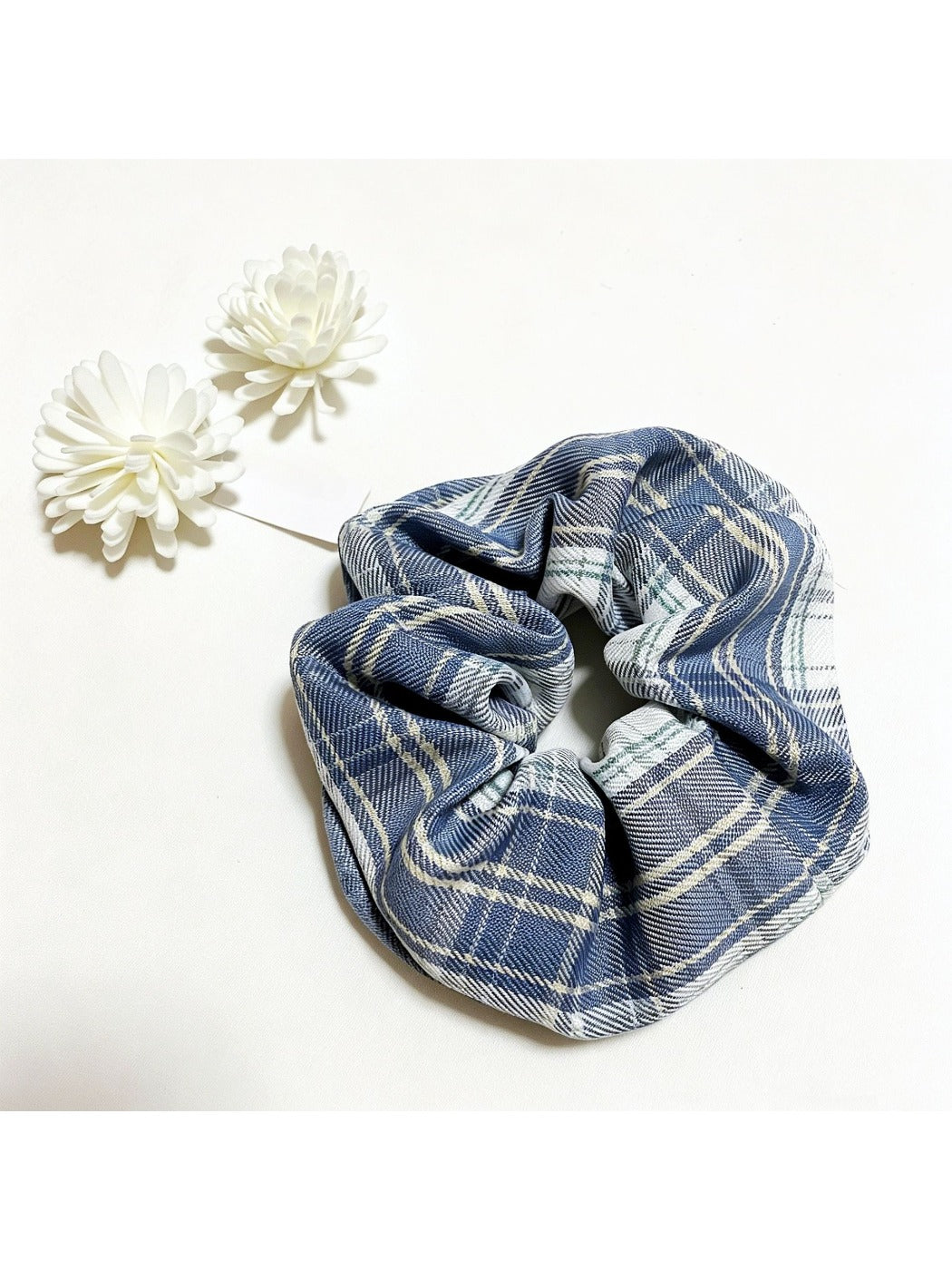 Side view of Gifty plaid scrunchie highlighting gathered fabric design