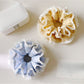 Close-up of Gifty polka dot double layer lace scrunchie showing lace texture and pattern