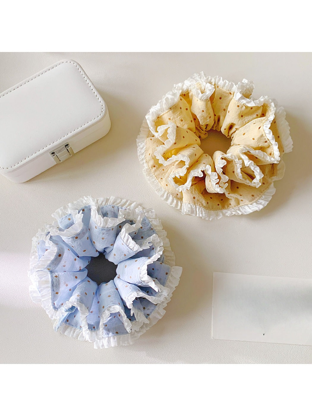 Close-up of Gifty polka dot double layer lace scrunchie showing lace texture and pattern