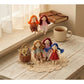 Fabric yarn doll keychain hanging from a metal keyring on a white background