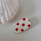 Beau hair clip photographed with soft lighting to emphasize its vintage elegance