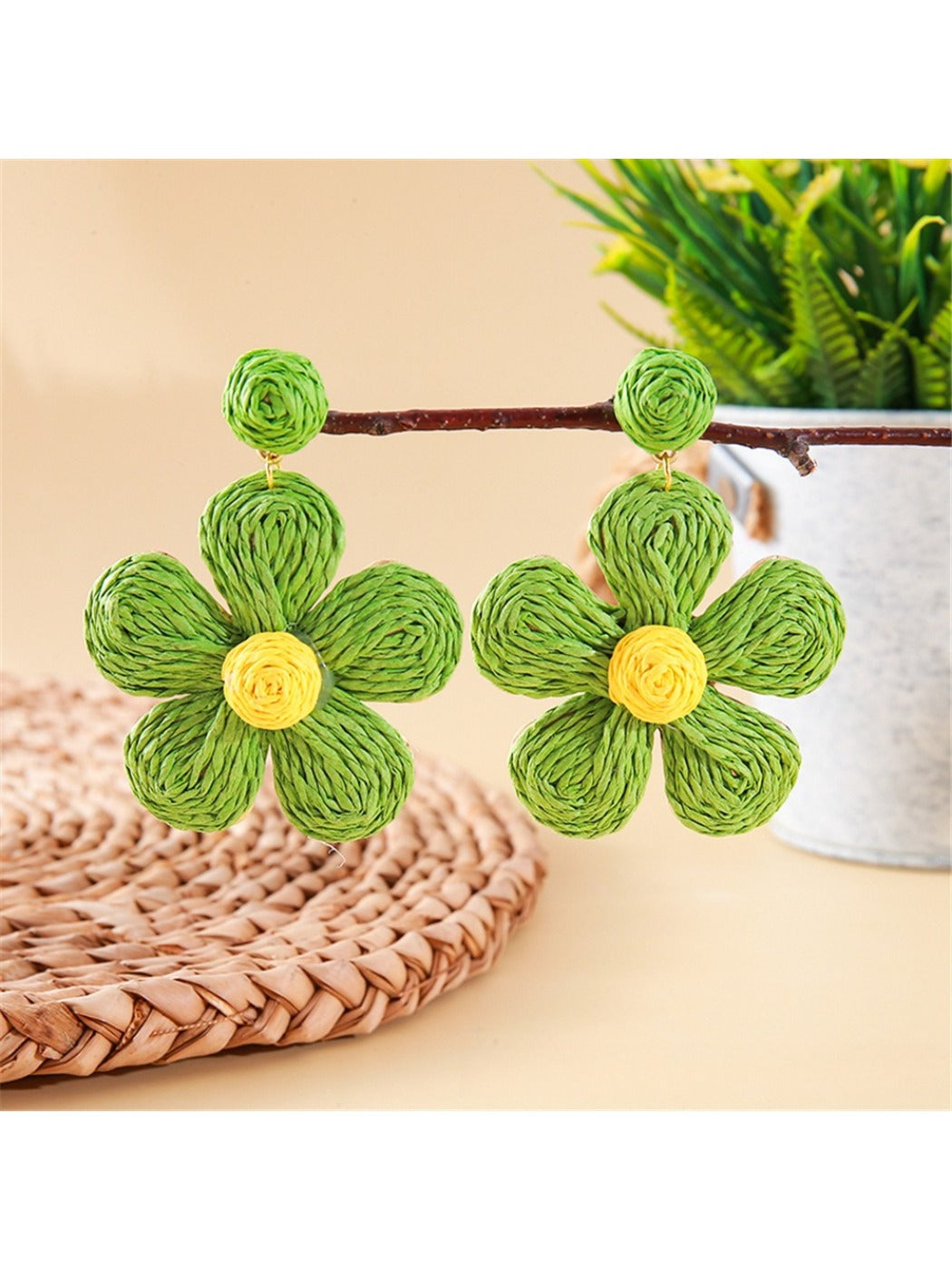 Earedge flower shaped knitted earrings in soft pink and cream colors